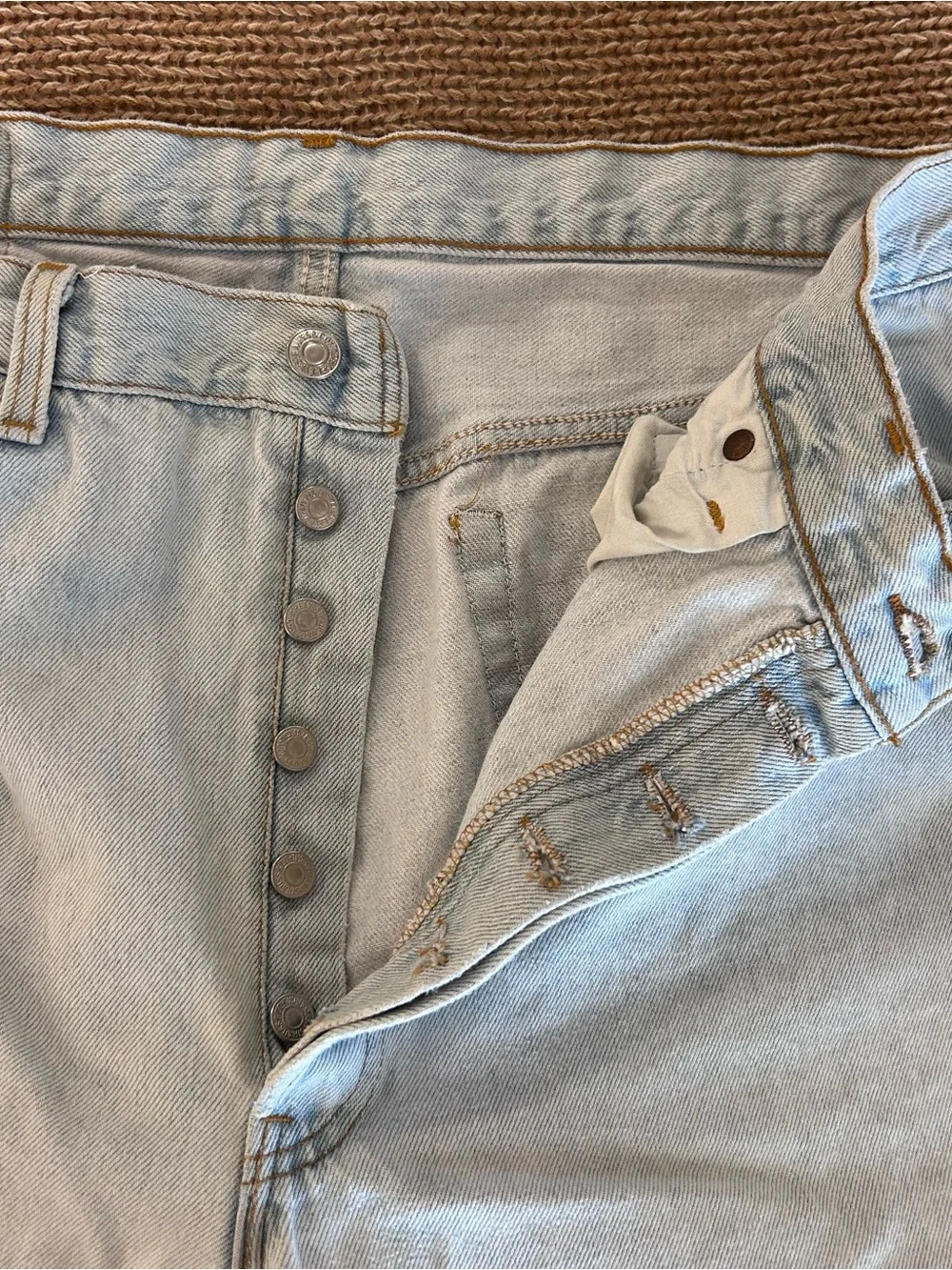 Vintage 1993 men's Levi's 501 light blue denim jeans with leather patch 38×34